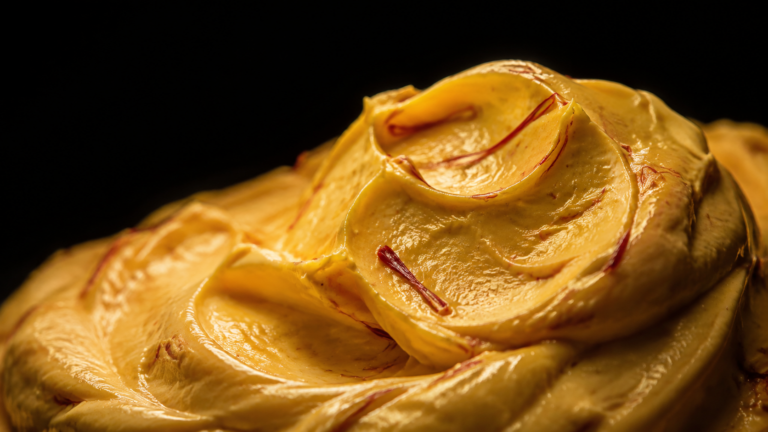Golden saffron cream texture with saffron threads
